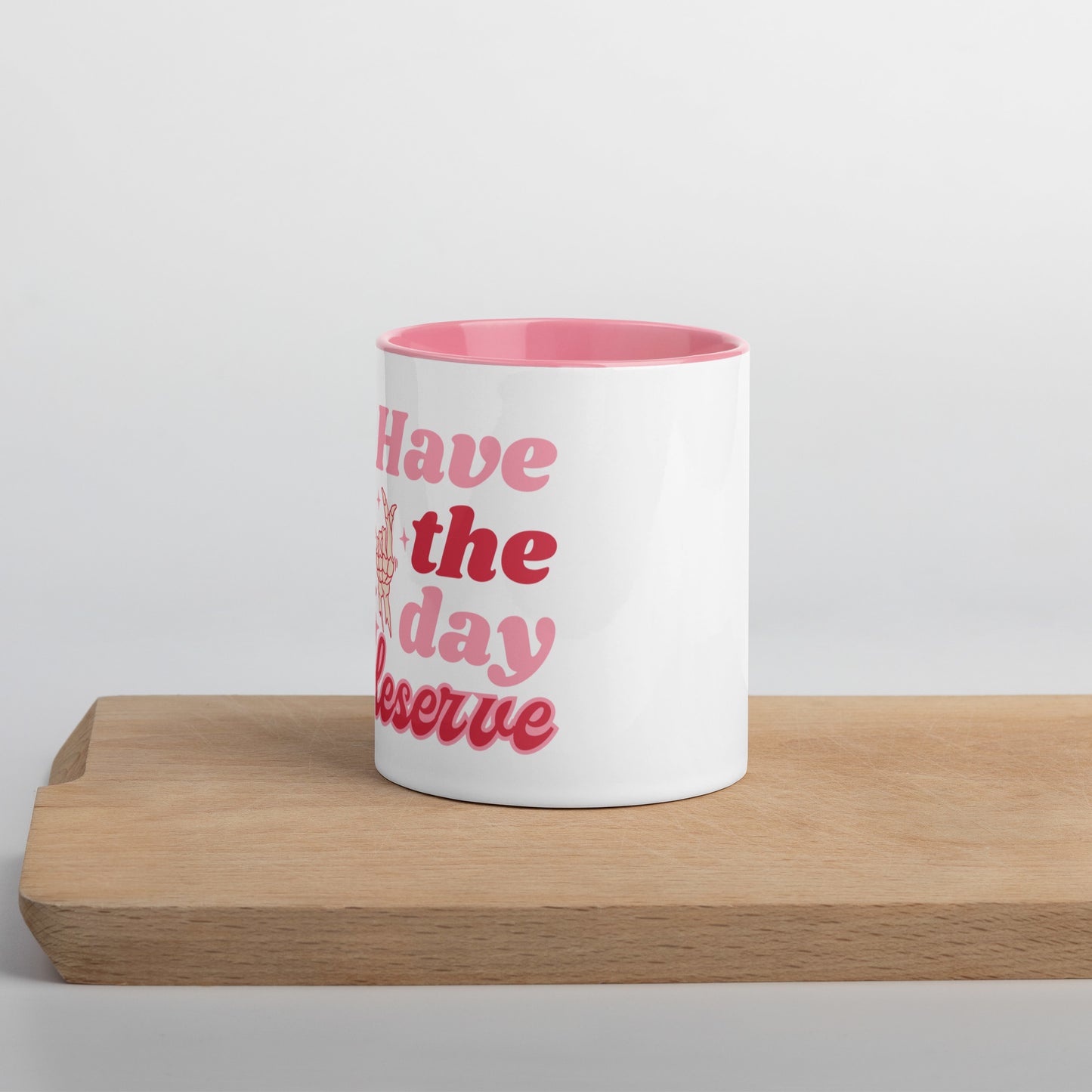 “Have the day you deserve” pink coffee mug