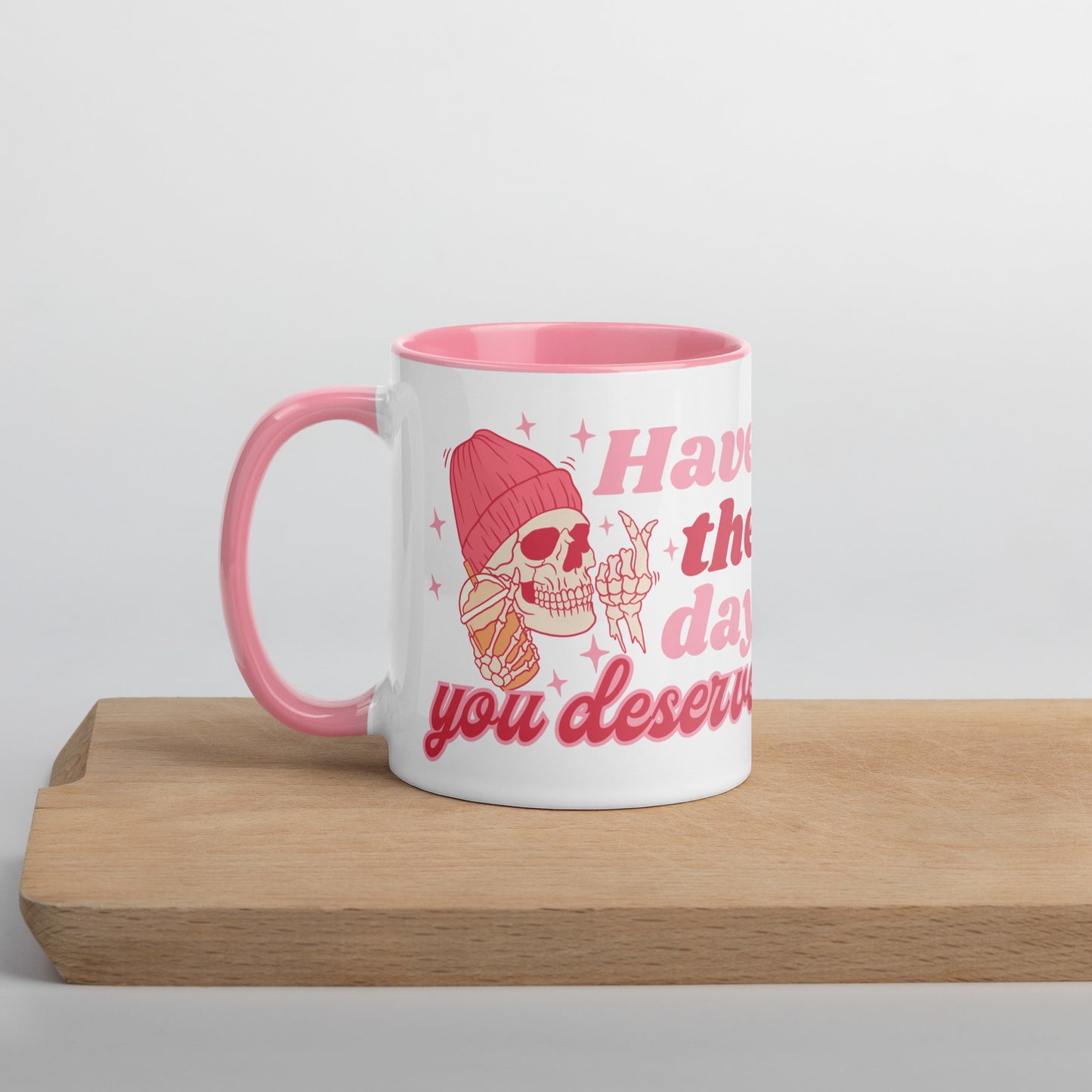 “Have the day you deserve” pink coffee mug